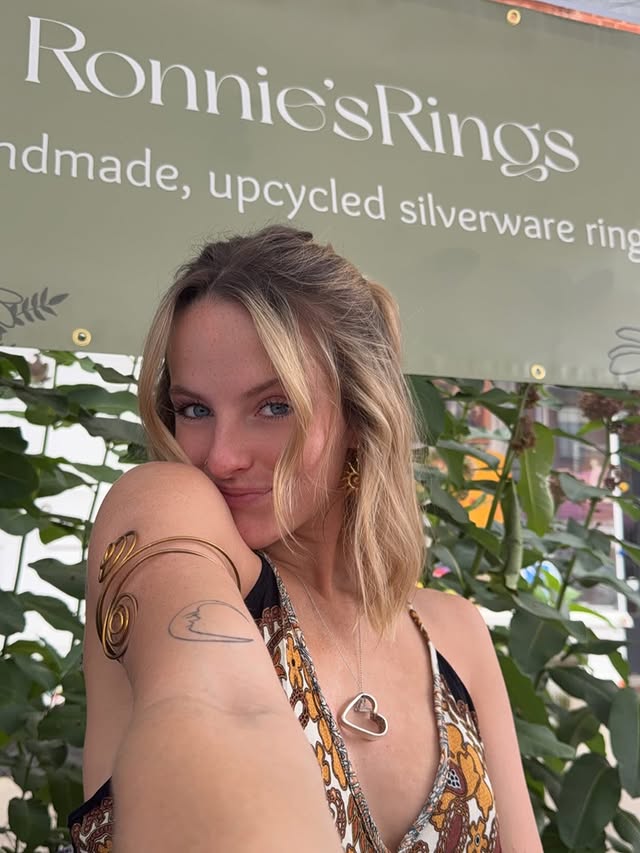 Cam wearing a stack of handmade rings.